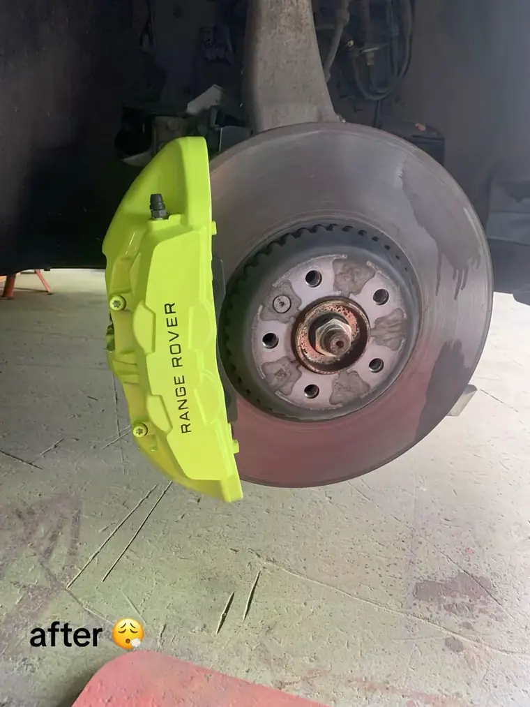 The finished lime green Range Rover brake calliper with its decal