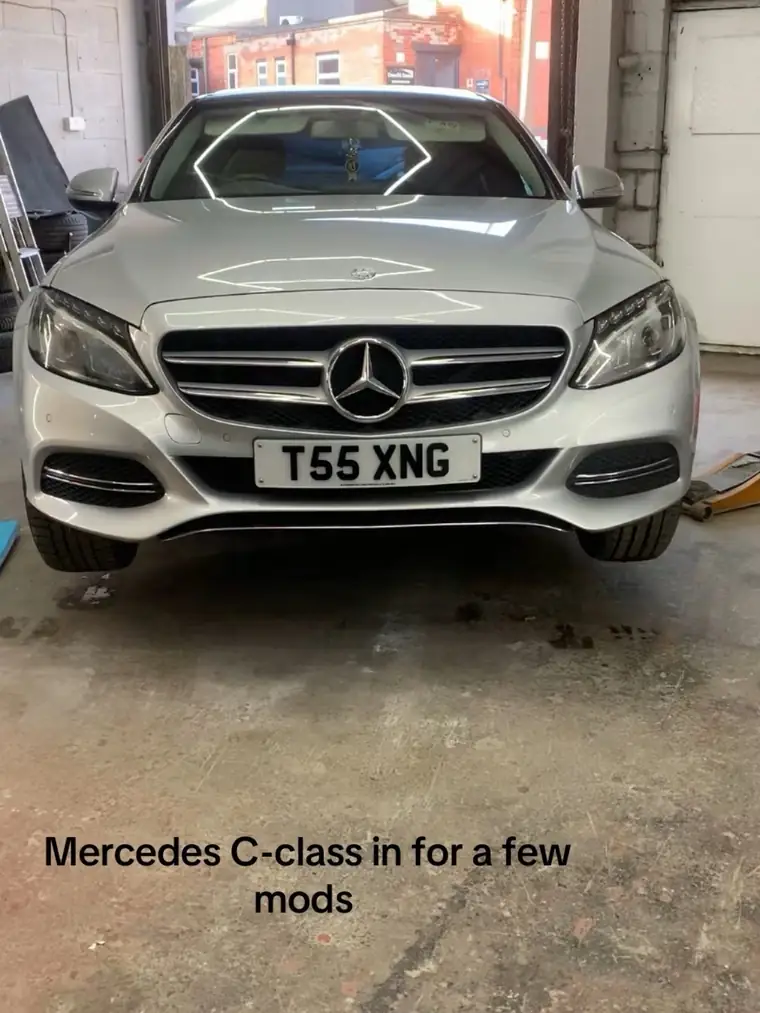 Silver Mercedes C-Class with the standard chrome front grille