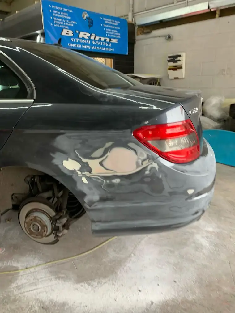 Rear quarter of the Mercedes filled and primed before painting