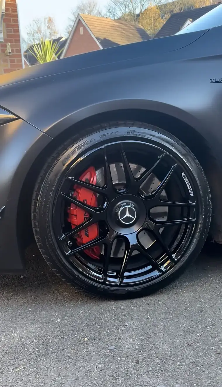 Mercedes-AMG on gloss black alloys with red brake callipers